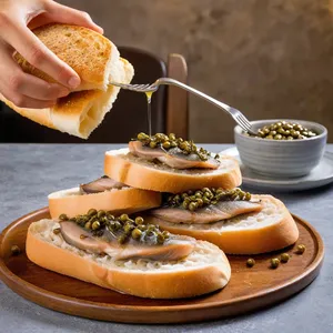 Рецепт Брускетты с анчоусами и лимонным цедрой - Выкладка анчоусов
