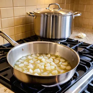 Рецепт Буйабес с морскими гребешками и шафраном - Обжарка лука и чеснока