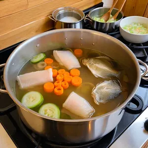 Рецепт Бульон из карпа с можжевельником и мятой - Приготовление бульона