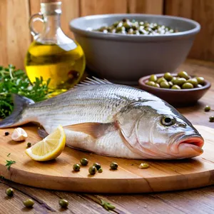Рецепт Дорадо в фольге с оливками и каперсами - Подготовка рыбы и ингредиентов