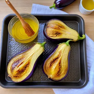 Рецепт Фаршированные баклажаны с хумусом и кедровыми орешками - Запекание баклажанов