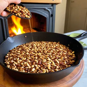 Рецепт Карпаччо из зубчатки с гранатовым соусом и кедровыми орешками - Обжарка кедровых орешков