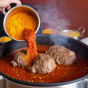 Рецепт Харира с бараниной и персиками - Добавление специй и томатной пасты