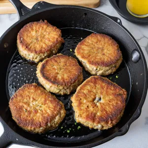 Рецепт Котлеты из сардины с майораном и томатным соусом - Жарка котлет