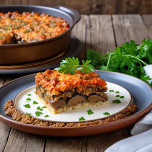 Рецепт Мясная запеканка с баклажанами и сливочным сыром - Подача