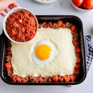 Рецепт Мясная запеканка с помидорами и моцареллой - Сборка запеканки