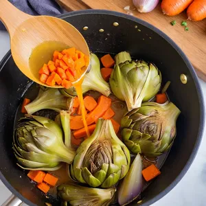 Рецепт Овощной плов с артишоками и кешью - Добавление артишоков и чеснока