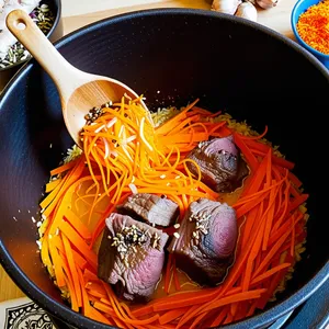 Рецепт Плов с бараниной и кумкватом - Добавление моркови и специй