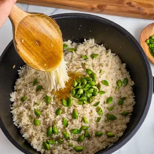 Рецепт Ризотто с артишоками и лимоном - Добавление артишоков и риса