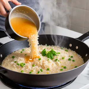 Рецепт Ризотто с морковью и имбирем - Постепенное добавление бульона