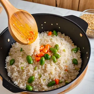 Рецепт Ризотто с цветной капустой и трюфельным маслом - Добавление риса