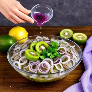 Рецепт Солёная сельдь с киви и кинзой - Сборка блюда