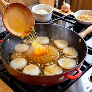 Рецепт Сосиски с грибами и сливочным соусом - Обжарка лука и чеснока
