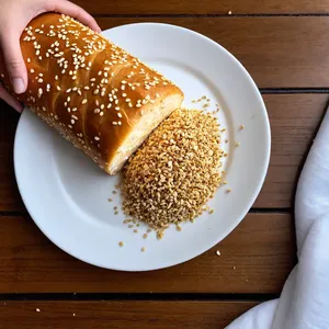 Рецепт Сырный рулет с инжиром и кунжутом - Обваливание в кунжуте