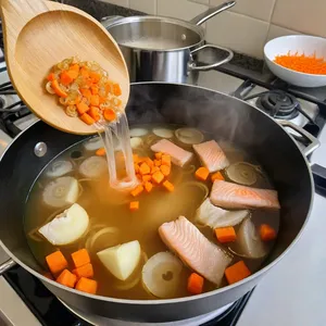 Рецепт Уха из форели с имбирем и укропом - Добавление овощей