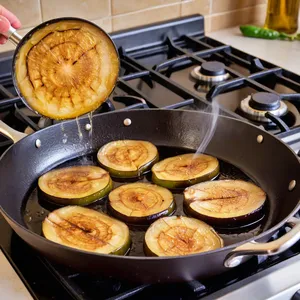 Рецепт Жареные баклажаны с медом и кедровыми орешками - Обжарка баклажанов