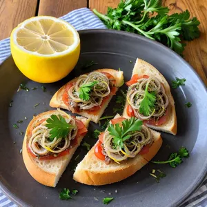 Брускетты с анчоусами и лимонным цедрой