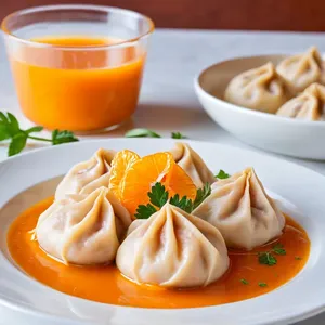 Манты с апельсином и уткой