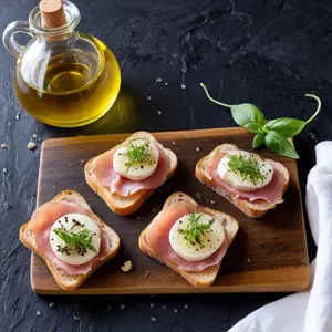 Тосты с трюфельным маслом и пармской ветчиной